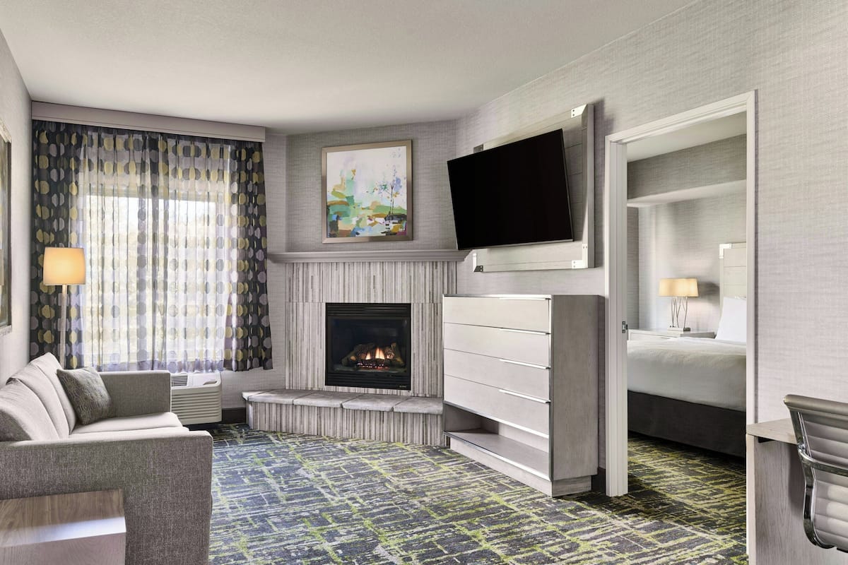 Suite, 1 Bedroom | Desk, blackout drapes, iron/ironing board, cribs (free)