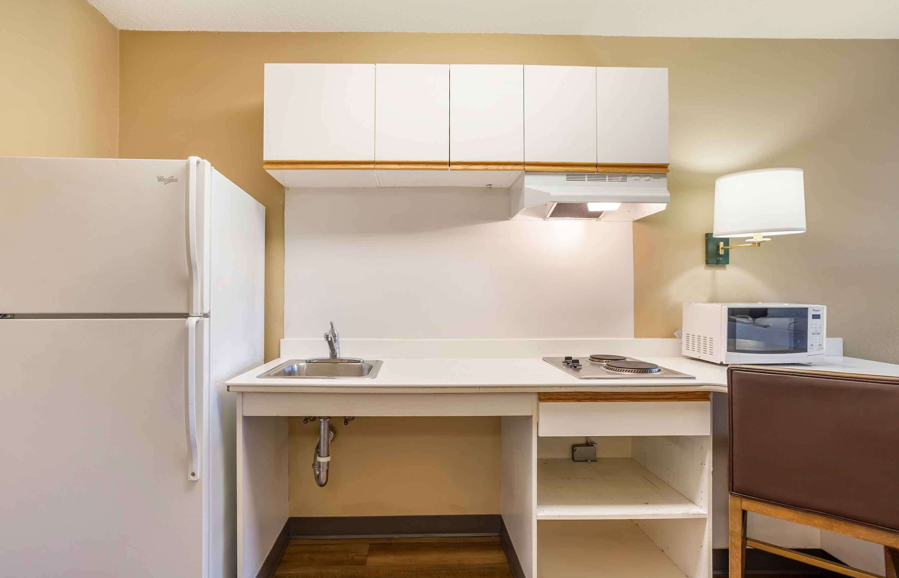 Full-sized fridge, microwave, stovetop, coffee/tea maker