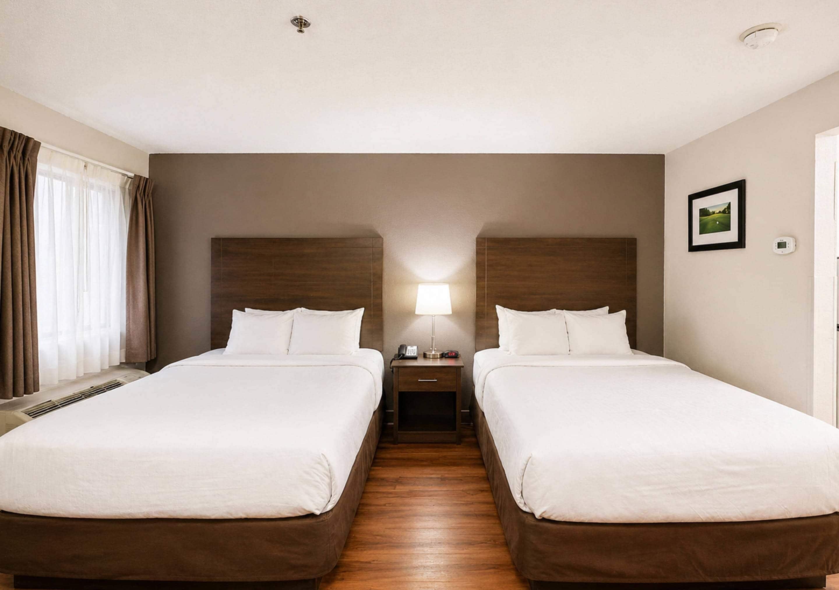 Room, 2 Queen Beds, Non Smoking (Efficiency) | In-room safe, desk, iron/ironing board, free cribs/infant beds