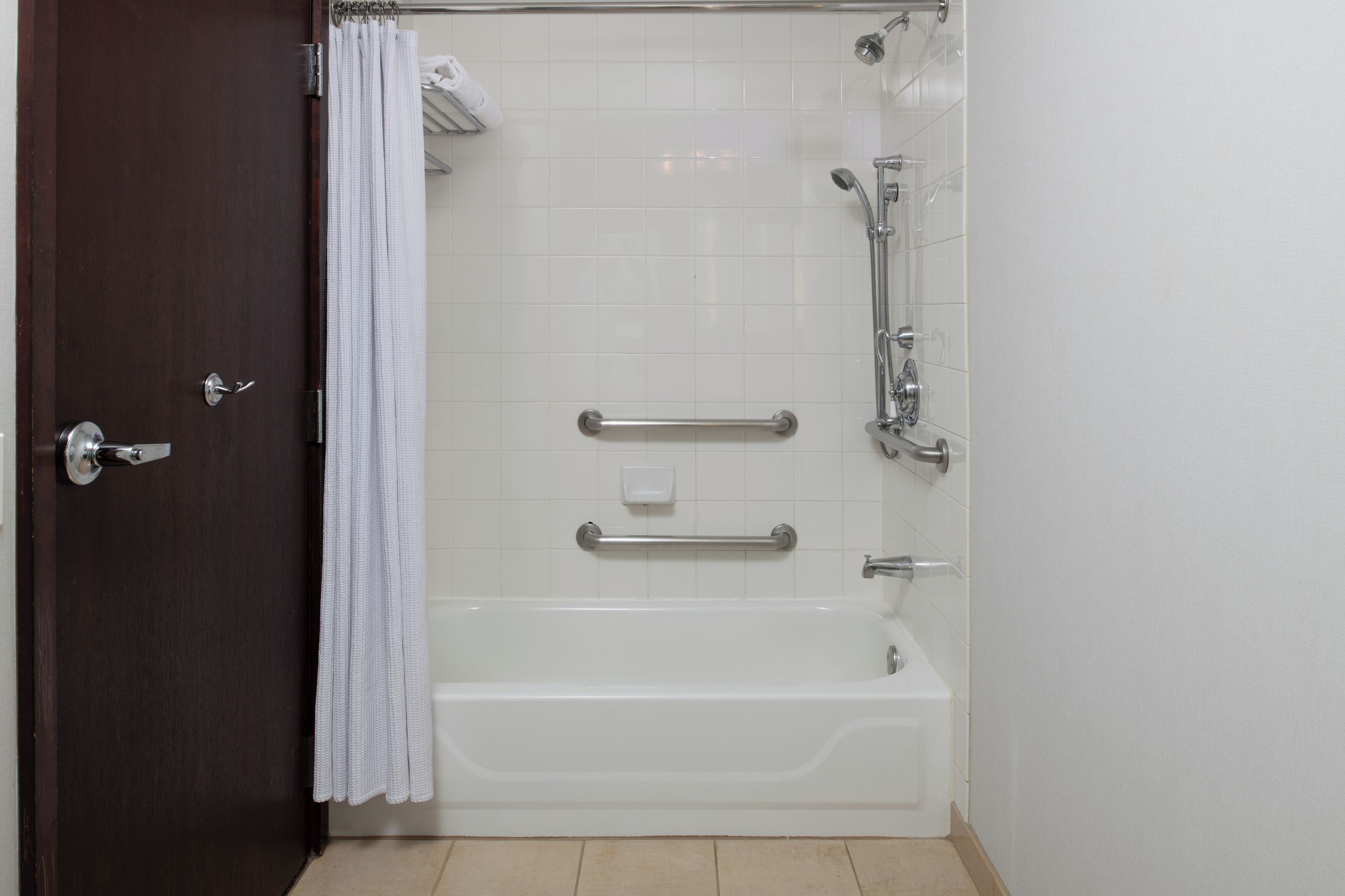 combined shower/bathtub, designer toiletries, hair dryer, bathrobes