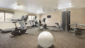 A gym with treadmills, elliptical machines, a stationary bike, and a medicine ball. - Baymont by Wyndham Elko (Elko)