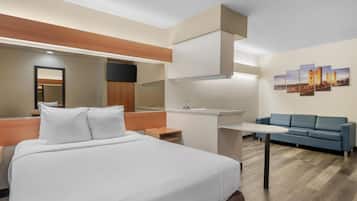Deluxe Room, 1 Queen Bed, Non Smoking, Refrigerator & Microwave | 1 bedroom, desk, laptop workspace, iron/ironing board