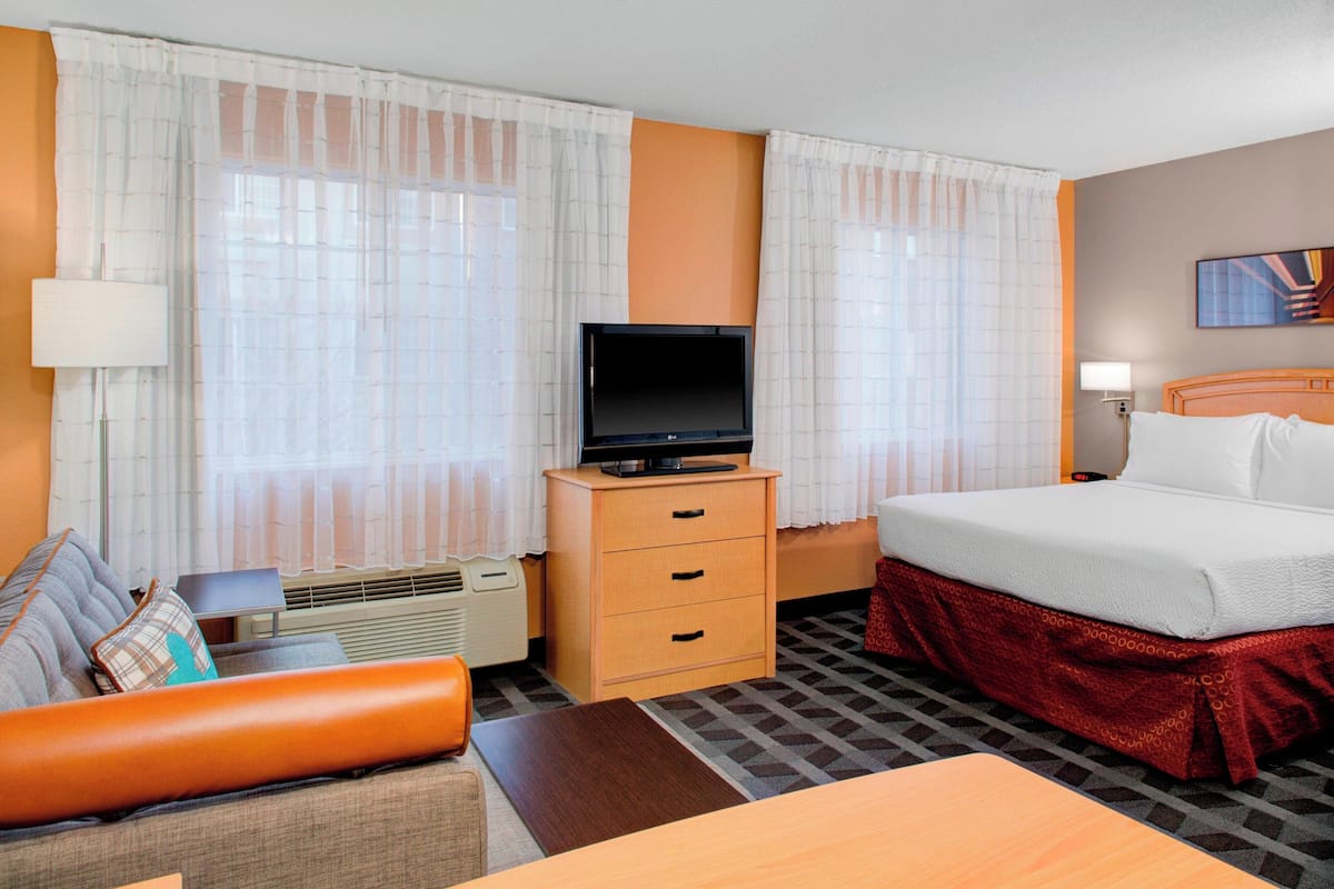 Hypo-allergenic bedding, desk, laptop workspace, blackout curtains