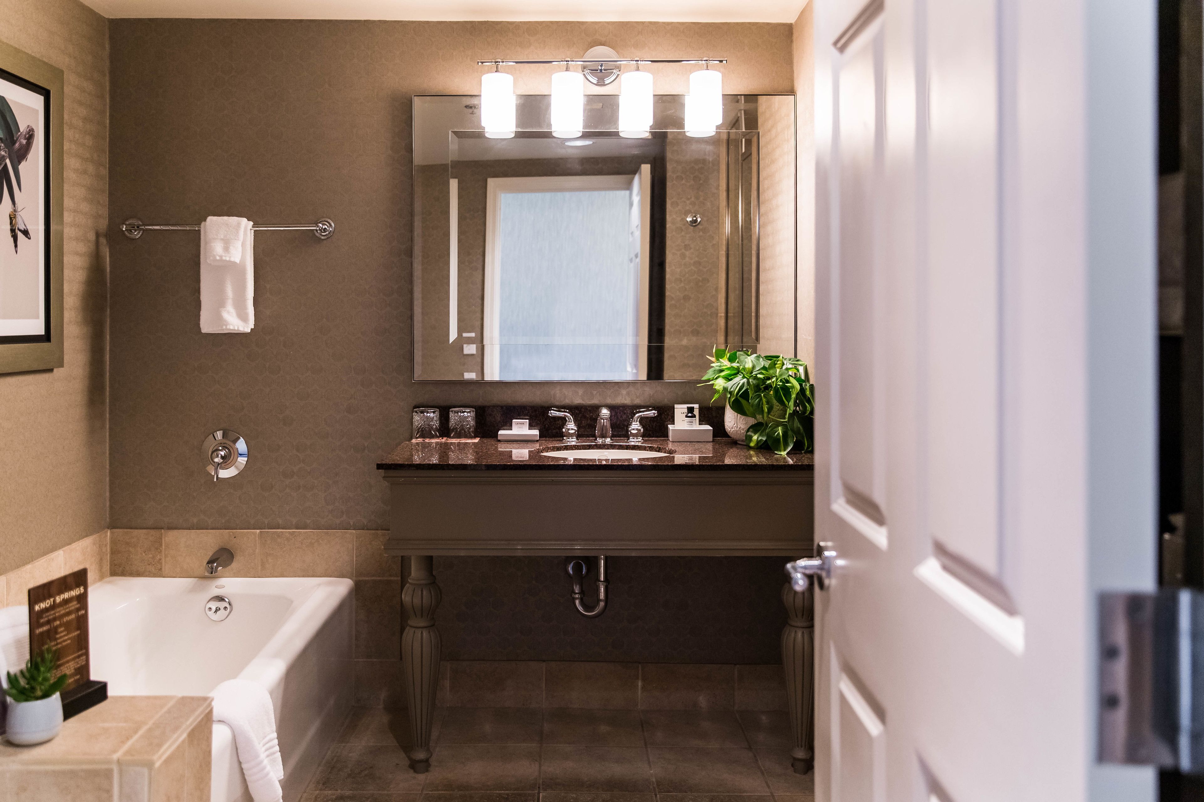 combined shower/bathtub, designer toiletries, hair dryer, bathrobes