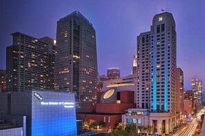 A cityscape with modern high-rise buildings, including a distinctive building with a large clock and a theater named "Blue Shield of California Theater". - W San Francisco (San Francisco)
