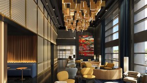 A modern lobby with seating areas, a large window, and a decorative ceiling. - W San Francisco (San Francisco)