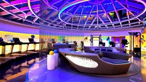 A modern fitness center with treadmills, a massage chair, and a unique ceiling design. - W San Francisco (San Francisco)