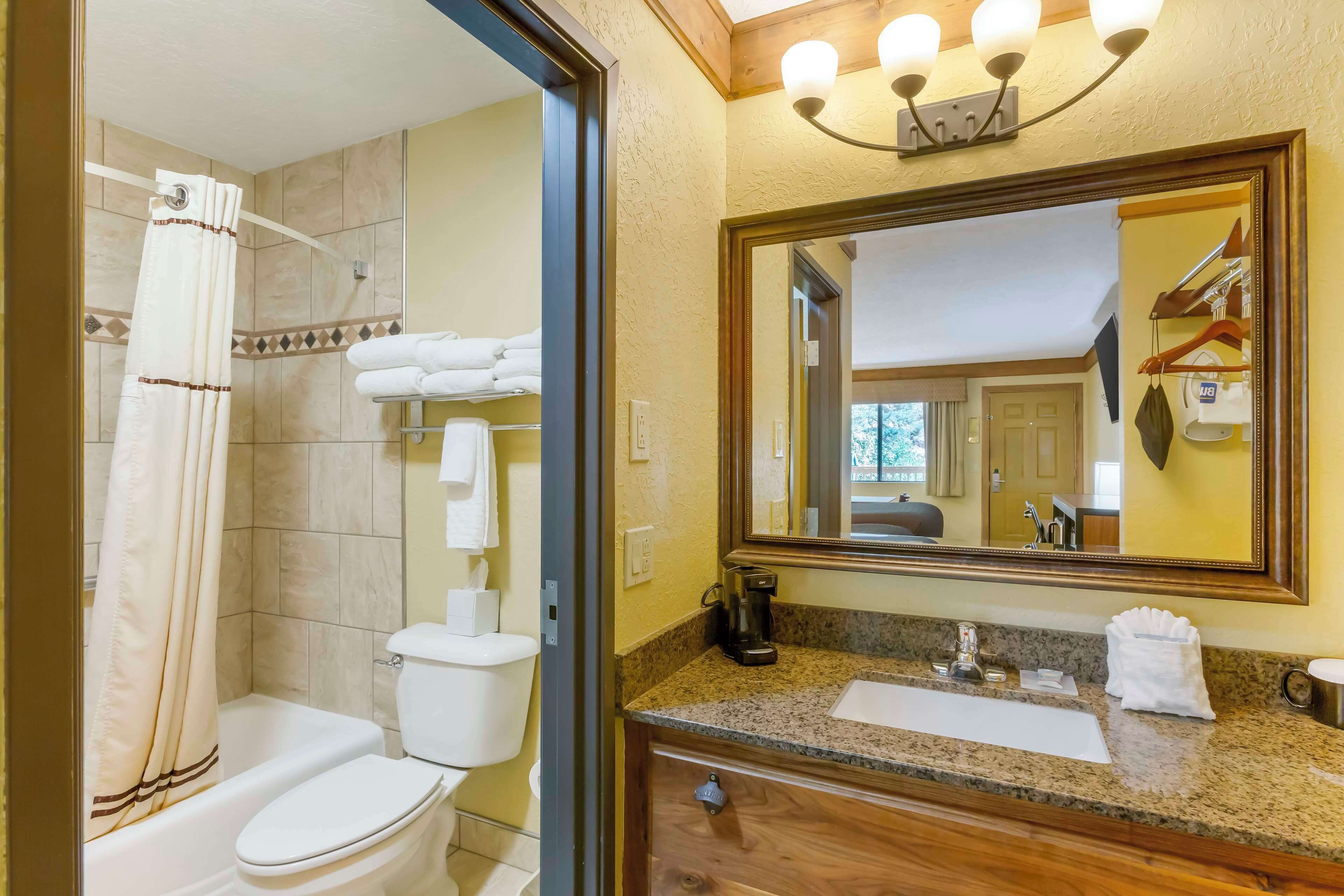 standard room, 2 queen beds, non smoking, microwave | bathroom | free toiletries, hair dryer, towels