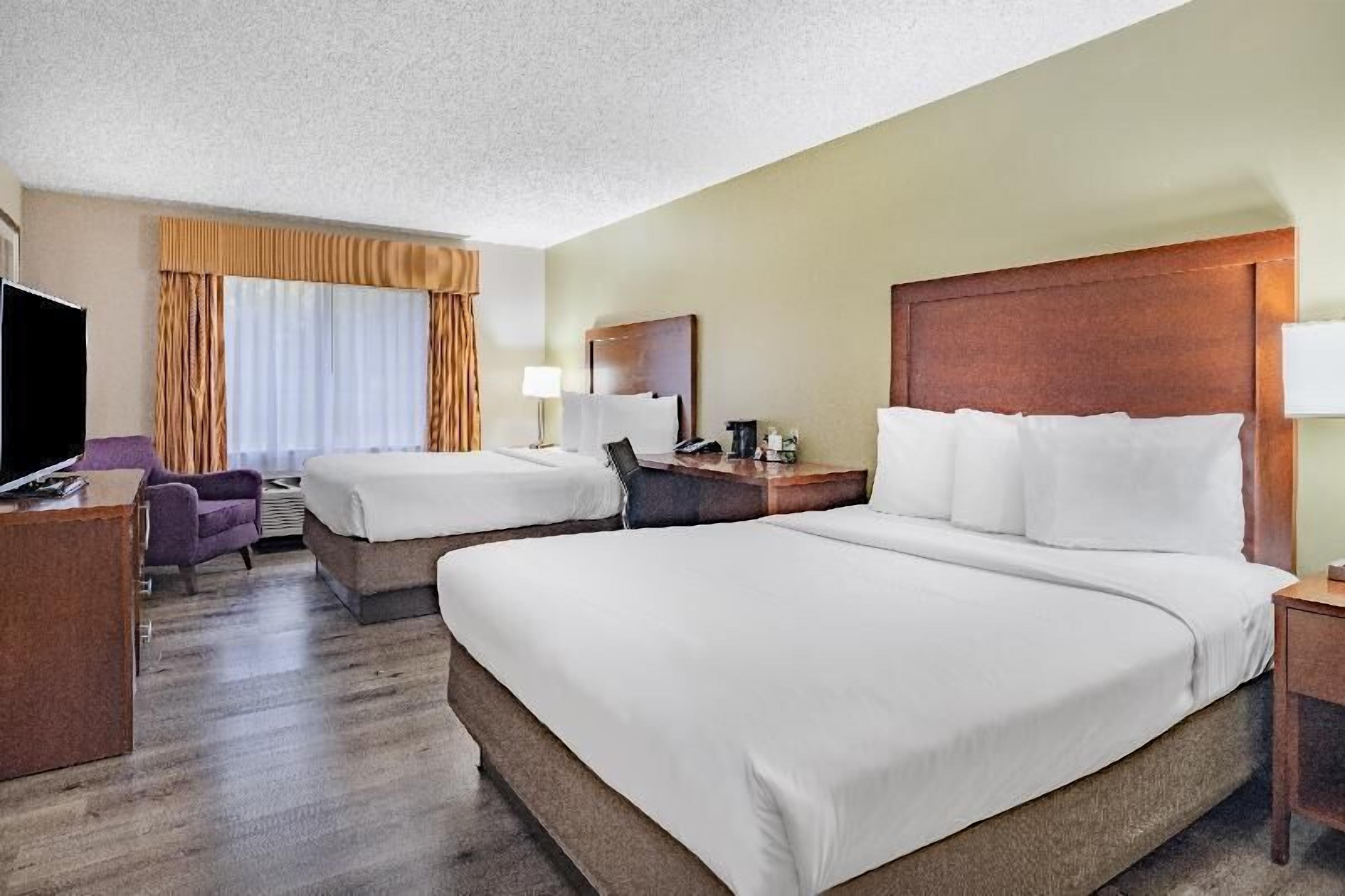 Premium bedding, pillowtop beds, desk, laptop workspace