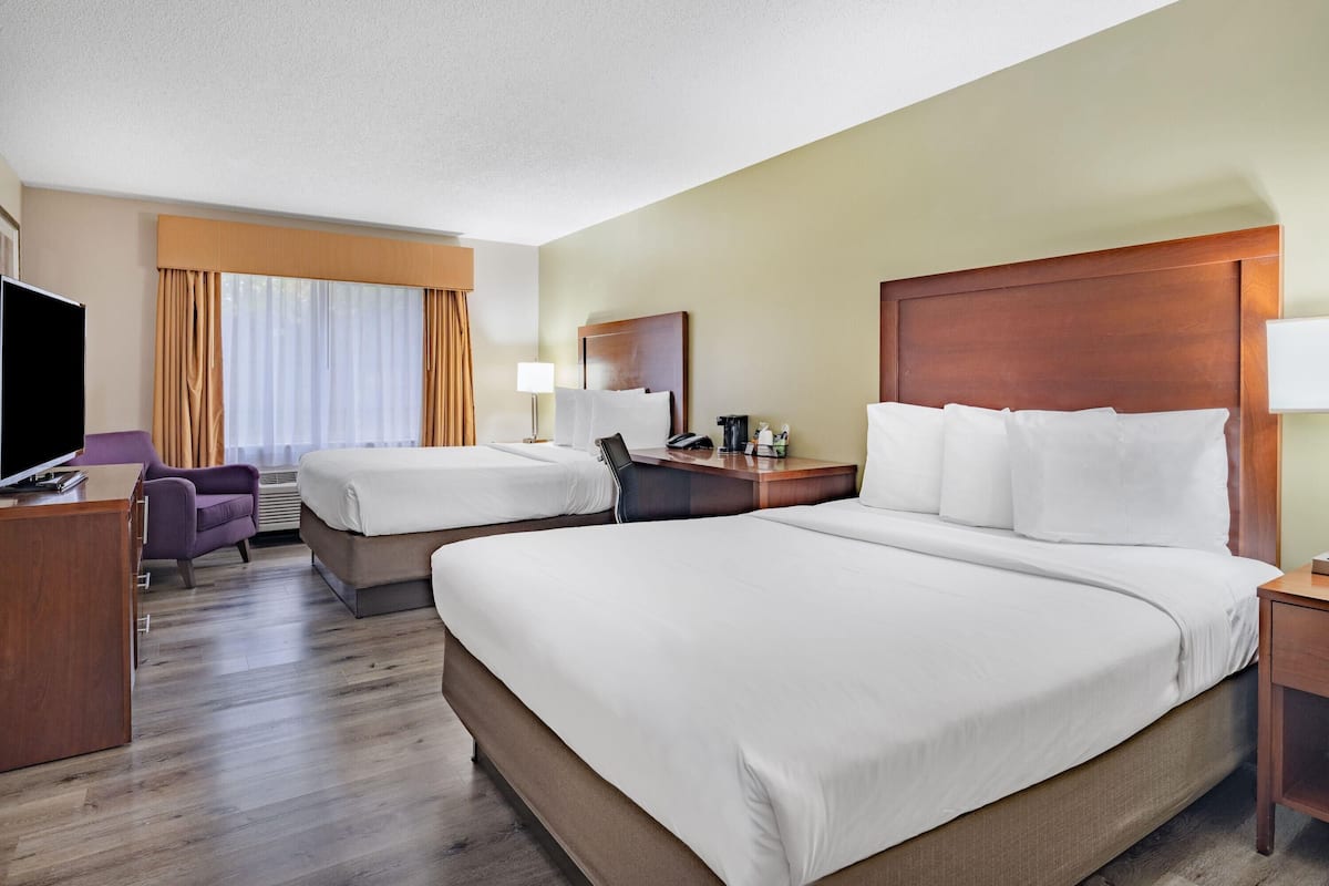 Premium bedding, pillow-top beds, desk, laptop workspace