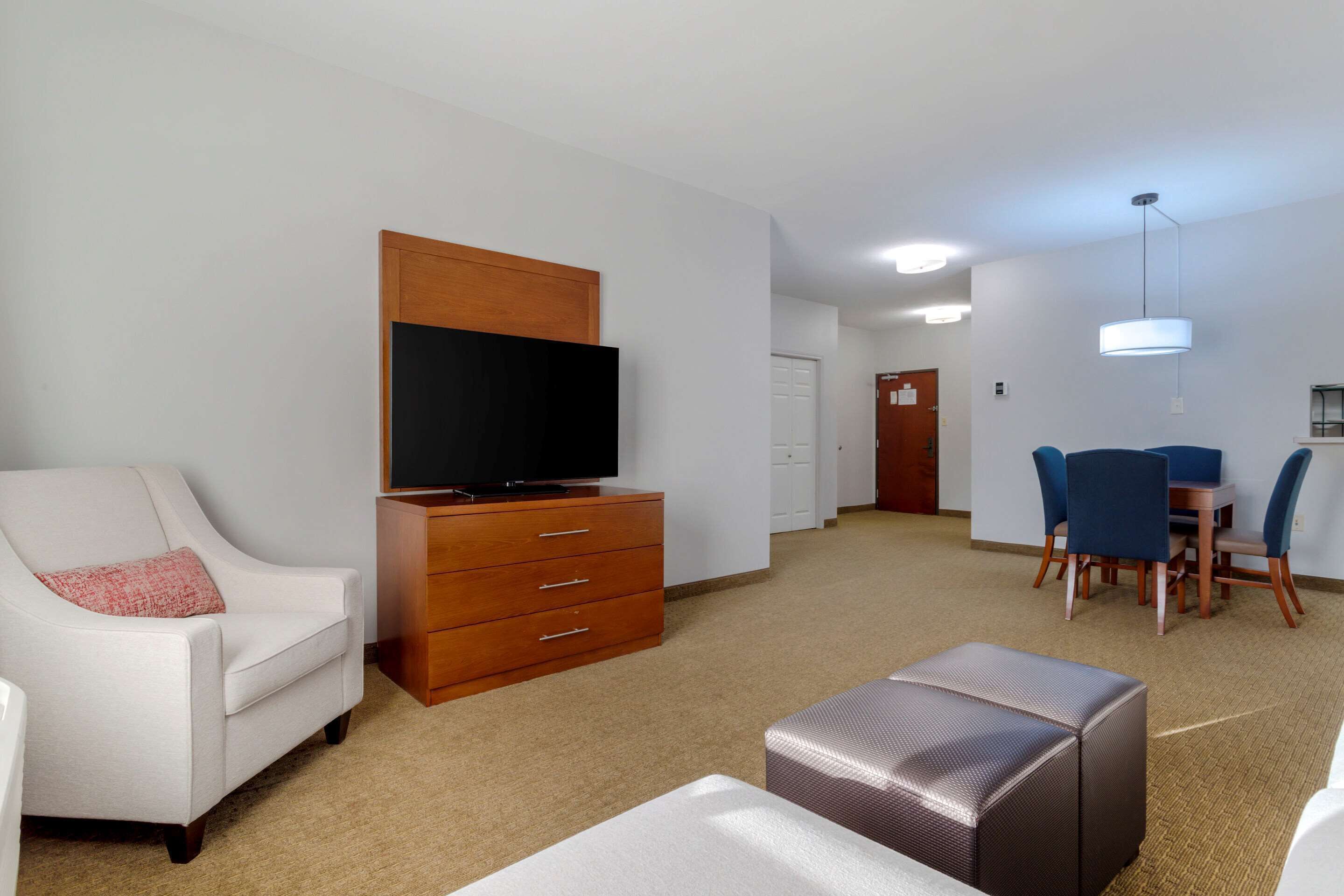 suite, multiple beds, non smoking | living room | 42-inch flat-screen tv with cable channels, tv