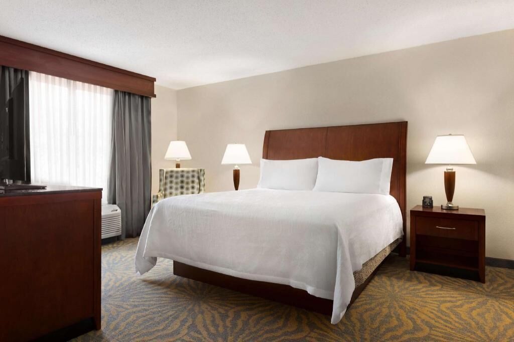 Premium bedding, desk, laptop workspace, iron/ironing board