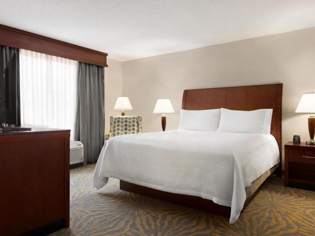 Premium bedding, desk, laptop workspace, iron/ironing board