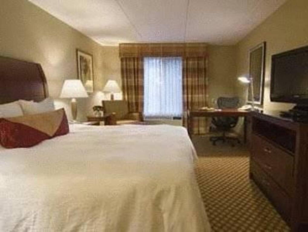Premium bedding, desk, laptop workspace, iron/ironing board