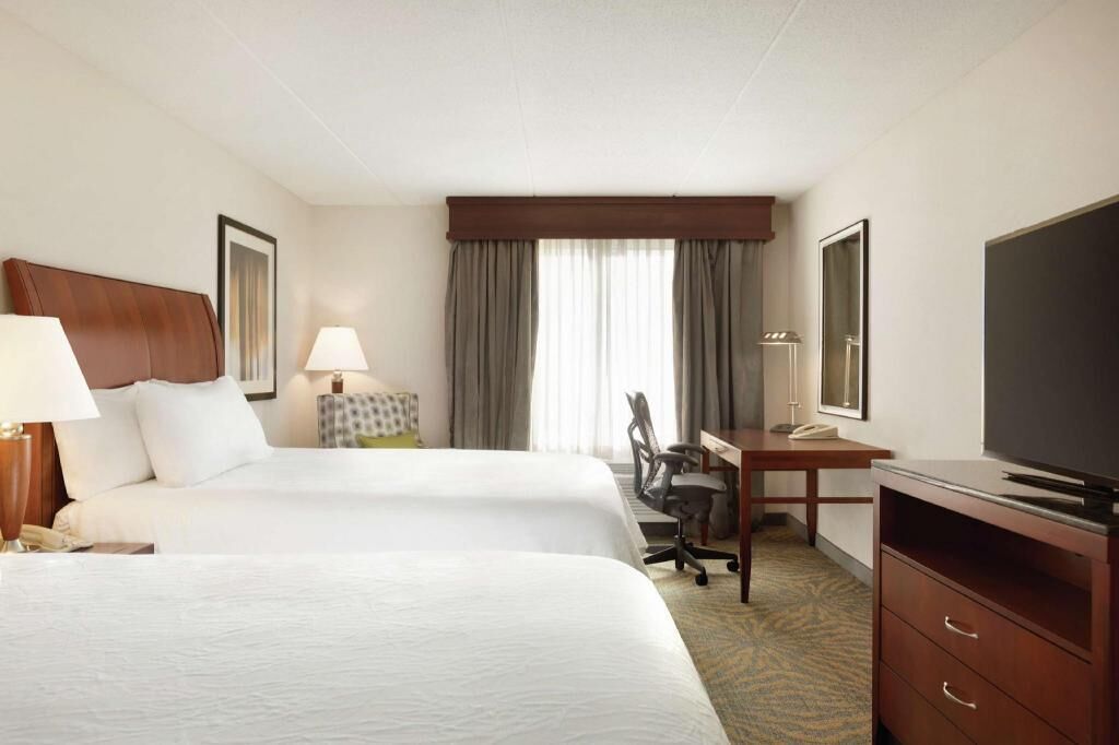 Premium bedding, desk, laptop workspace, iron/ironing board