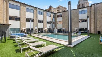 Outdoor pool, open 9:00 AM to 10:00 PM, pool umbrellas, sun loungers