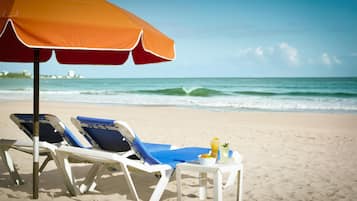 Beach nearby, white sand, sun loungers, beach umbrellas