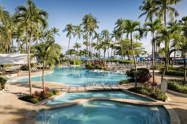 Outdoor pool, open 7:00 AM to 9:00 AM, cabanas (surcharge)