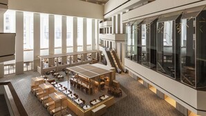 A spacious lobby with a central seating area, multiple levels, and large windows. - Hyatt Regency Houston Downtown (Houston)