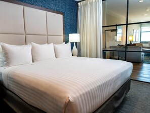 Deluxe City View Suite, 1 King Bed with Sofa Bed, Separate Living/Ding Area, Shower only | Egyptian cotton sheets, premium bedding, down comforters, pillowtop beds