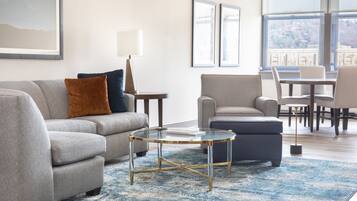 Deluxe City View Suite, 1 King Bed with Sofa Bed, Separate Living/Ding Area, Shower only | Living area