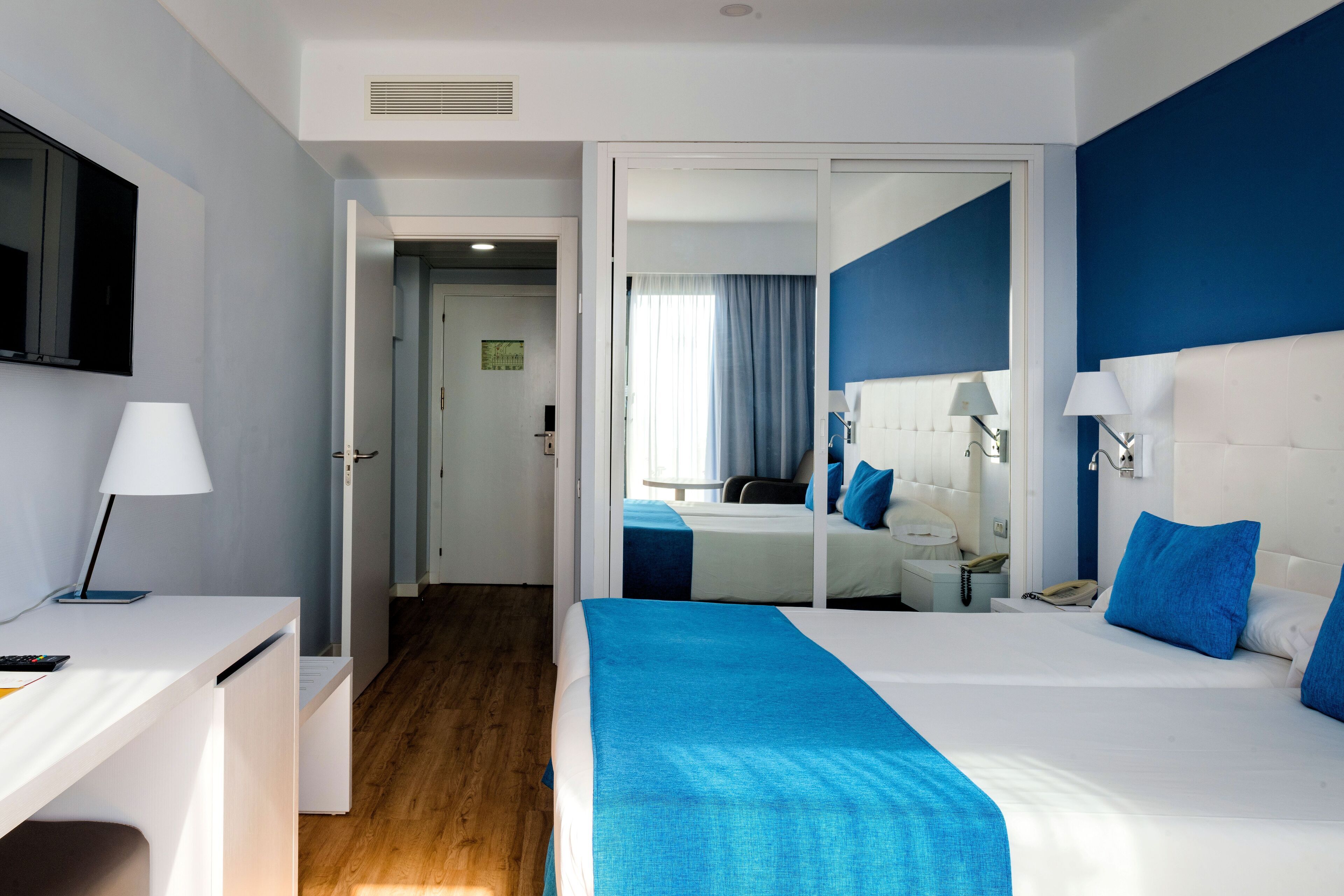 laptop workspace, blackout curtains, travel cot, bed sheets