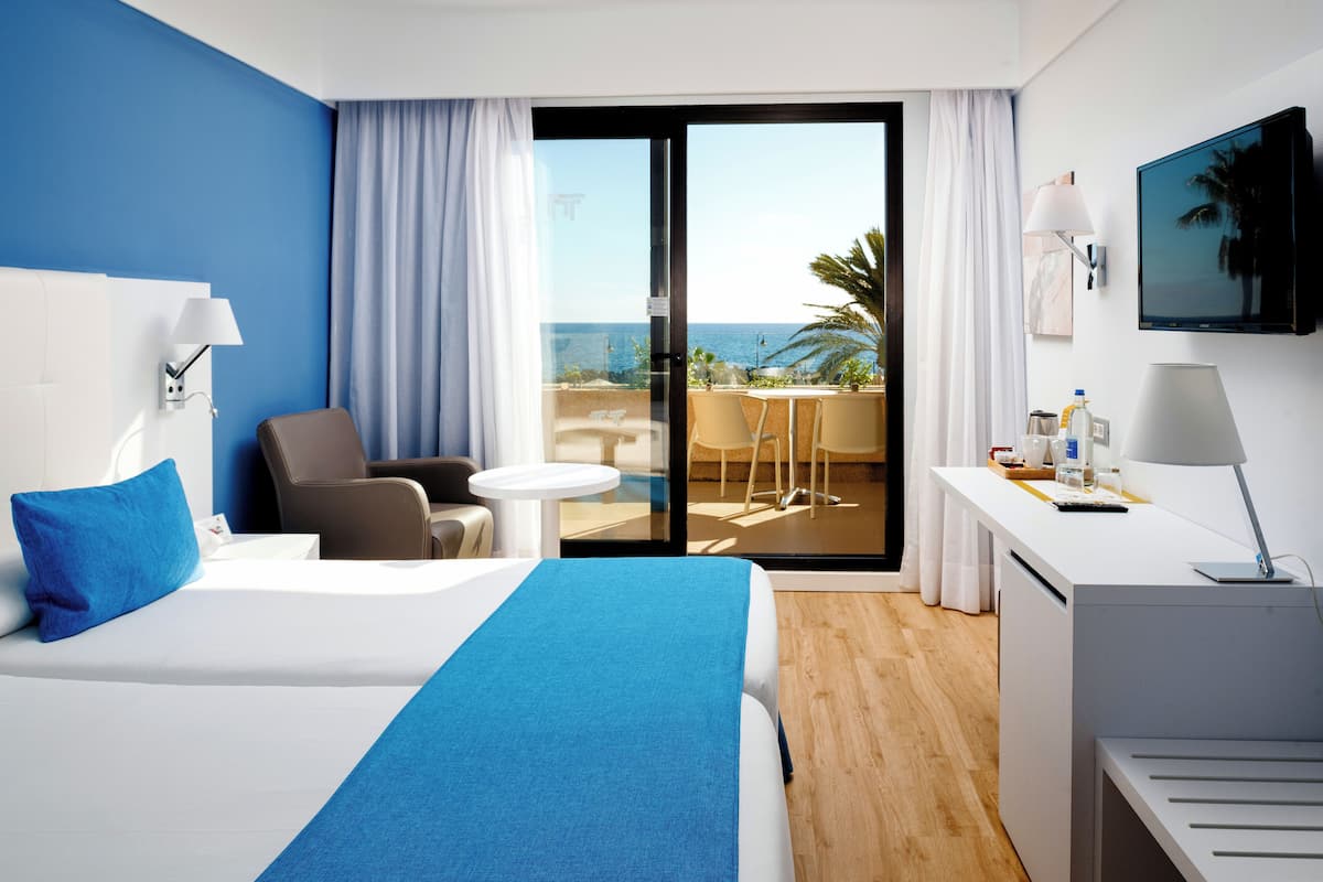 laptop workspace, blackout curtains, travel cot, bed sheets