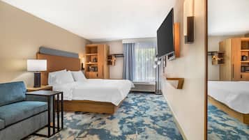King w/fridge, microwave | Living area | 32-inch TV with satellite channels, pay movies