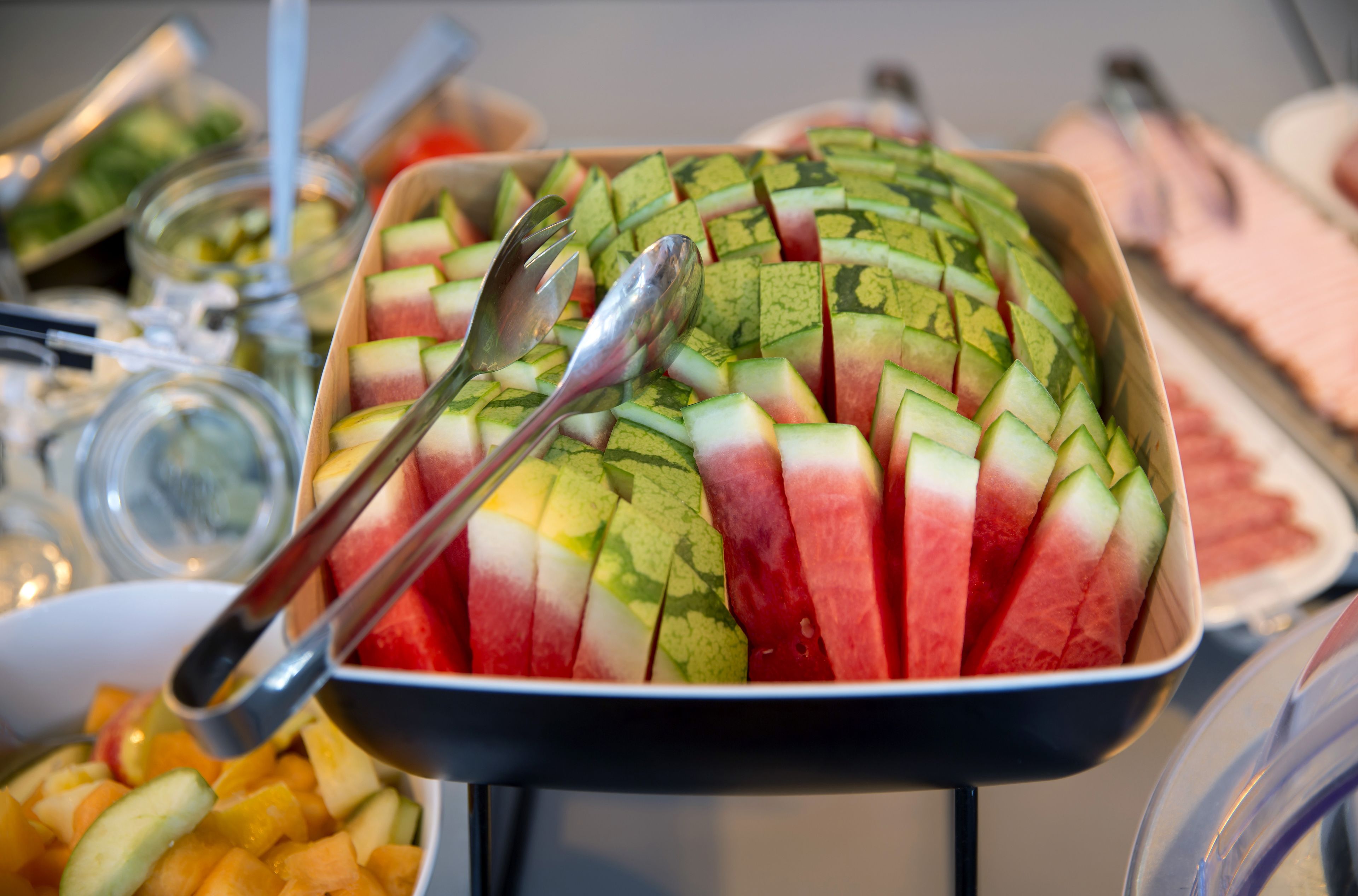 A tray of sliced watermelon and cantaloupe.