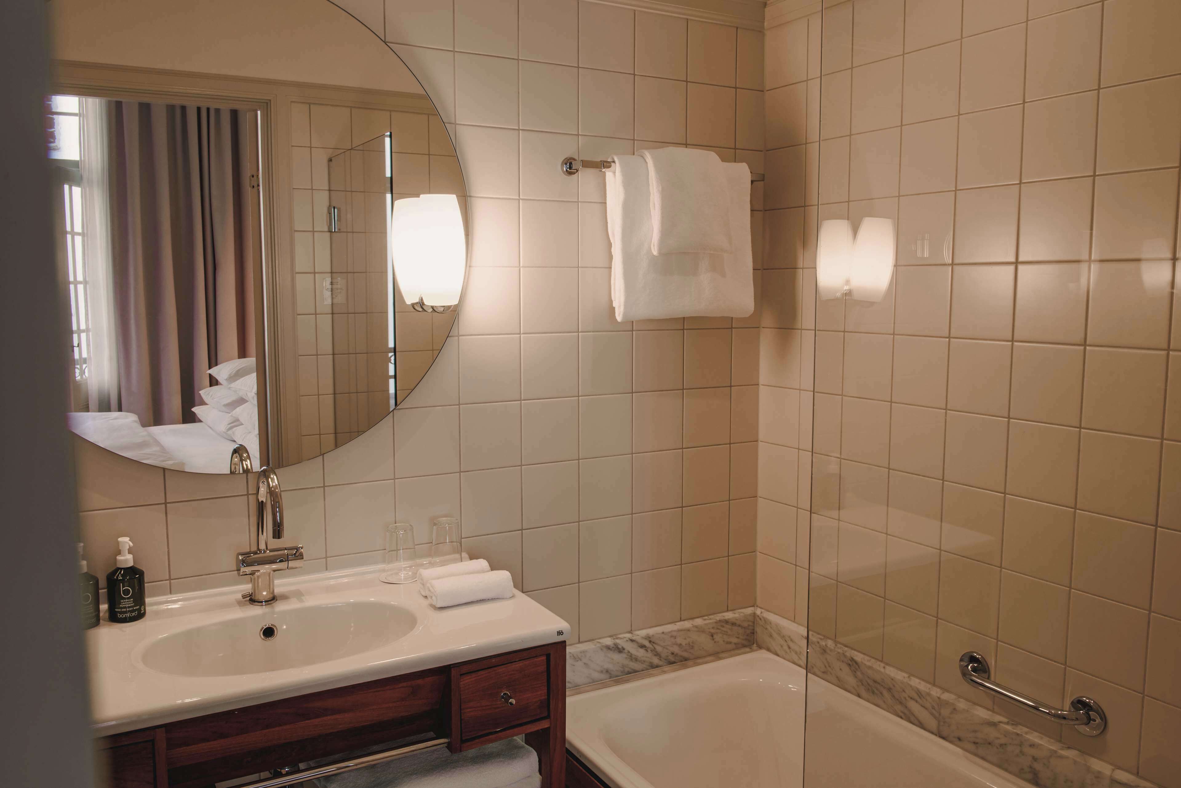 designer toiletries, hair dryer, bathrobes, slippers