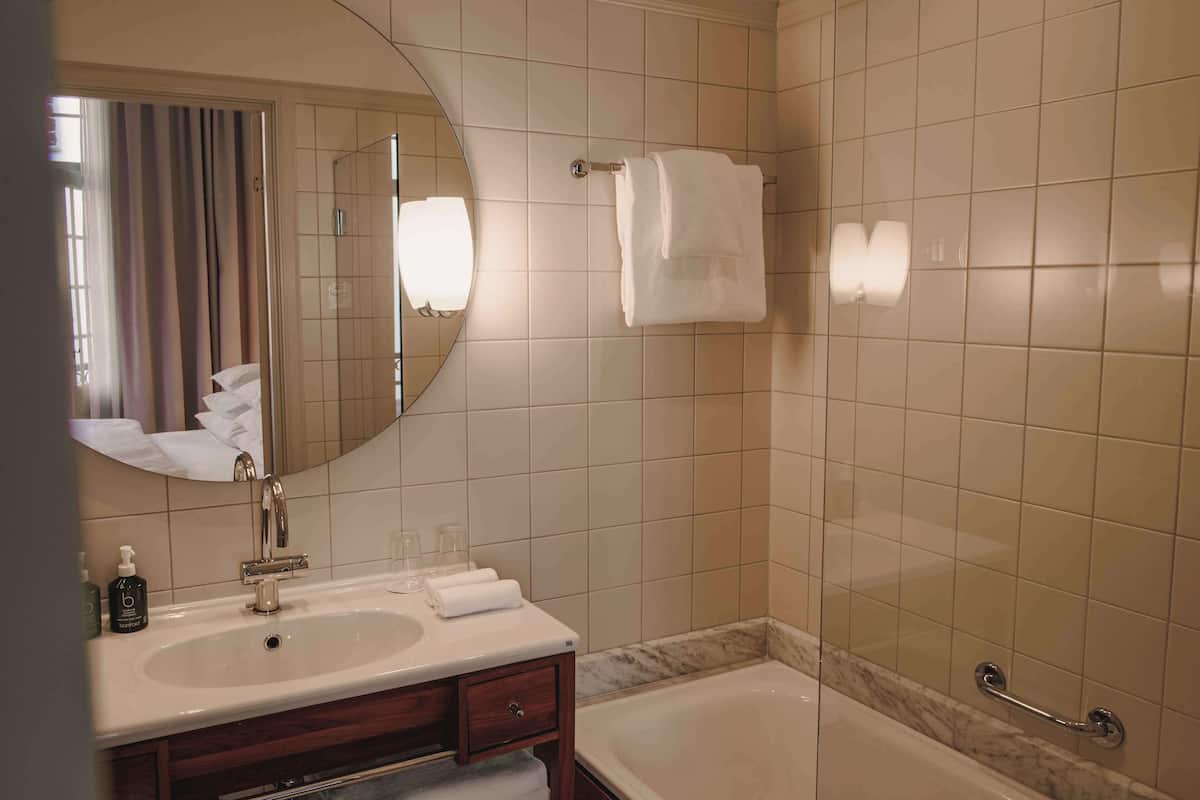 designer toiletries, hair dryer, bathrobes, slippers