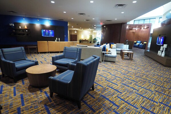 Relax in our welcoming lobby with a seating area, reception desk, and lounge space.