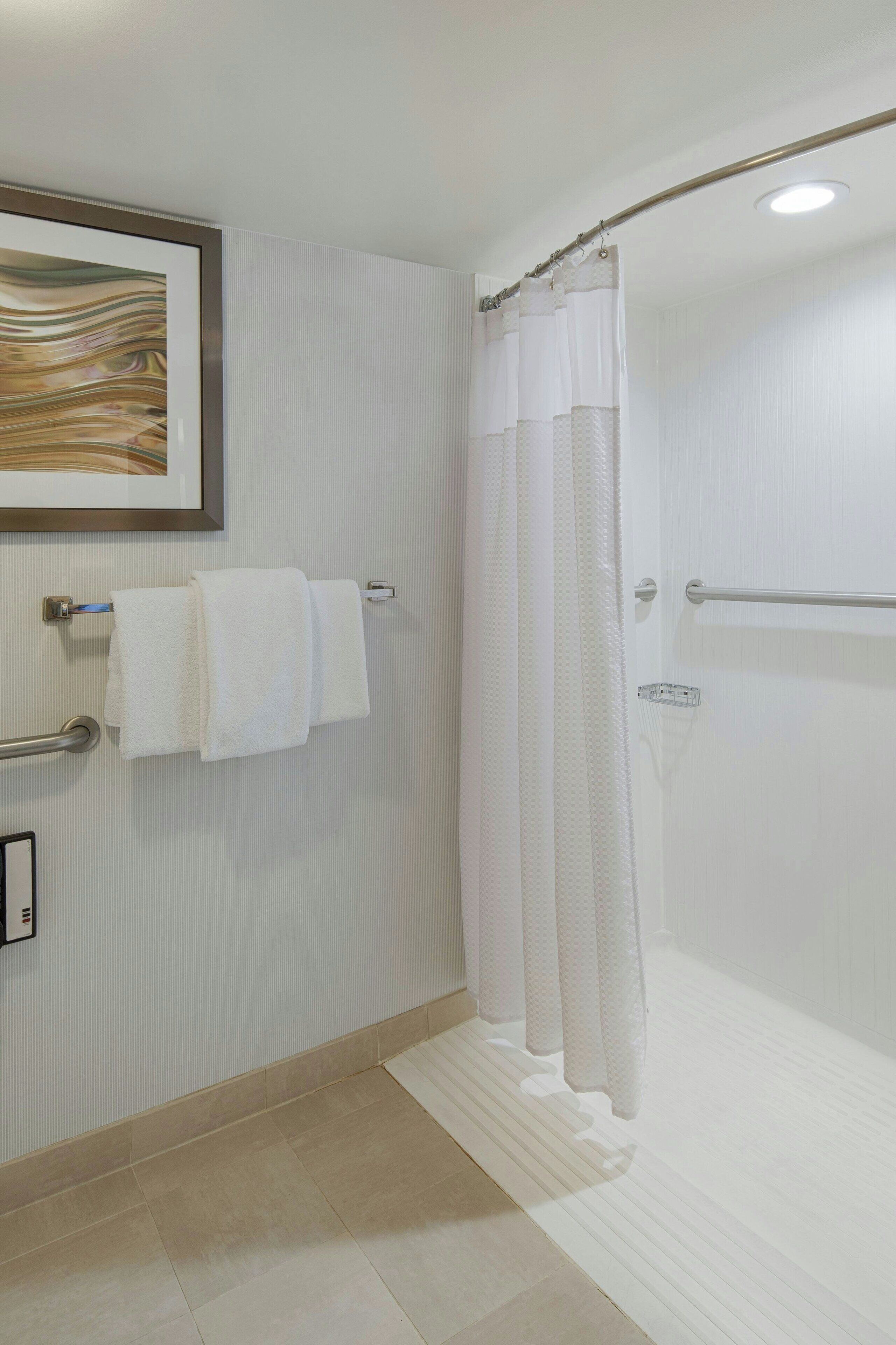 combined shower/bathtub, free toiletries, hair dryer, towels