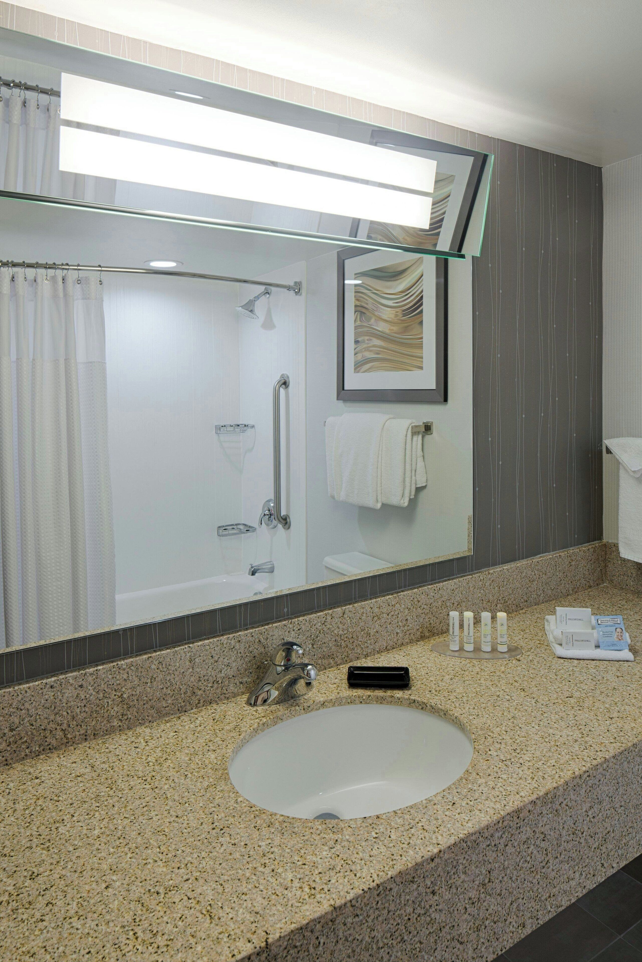 room, 2 queen beds | bathroom | combined shower/bathtub, free toiletries, hair dryer, towels