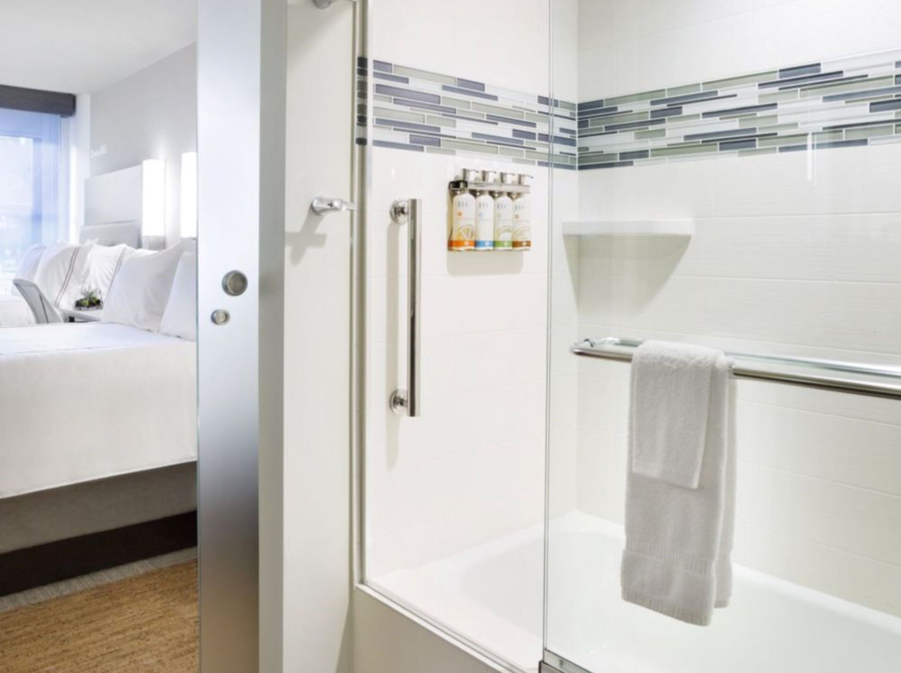 newly renovated 2 dbls bds bath shower combination | bathroom | designer toiletries, hair dryer, towels