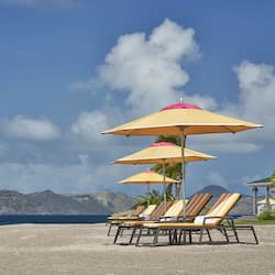 On the beach, beach cabanas, sun loungers, beach umbrellas