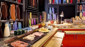 A buffet with various food items and beverages, including meats, cheeses, and a variety of drinks. - ibis Lyon Nord (Dardilly)