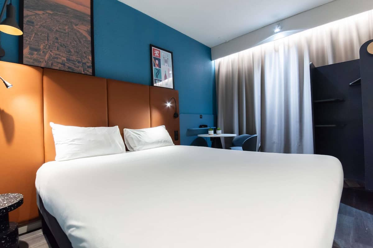 Premium bedding, desk, laptop workspace, soundproofing
