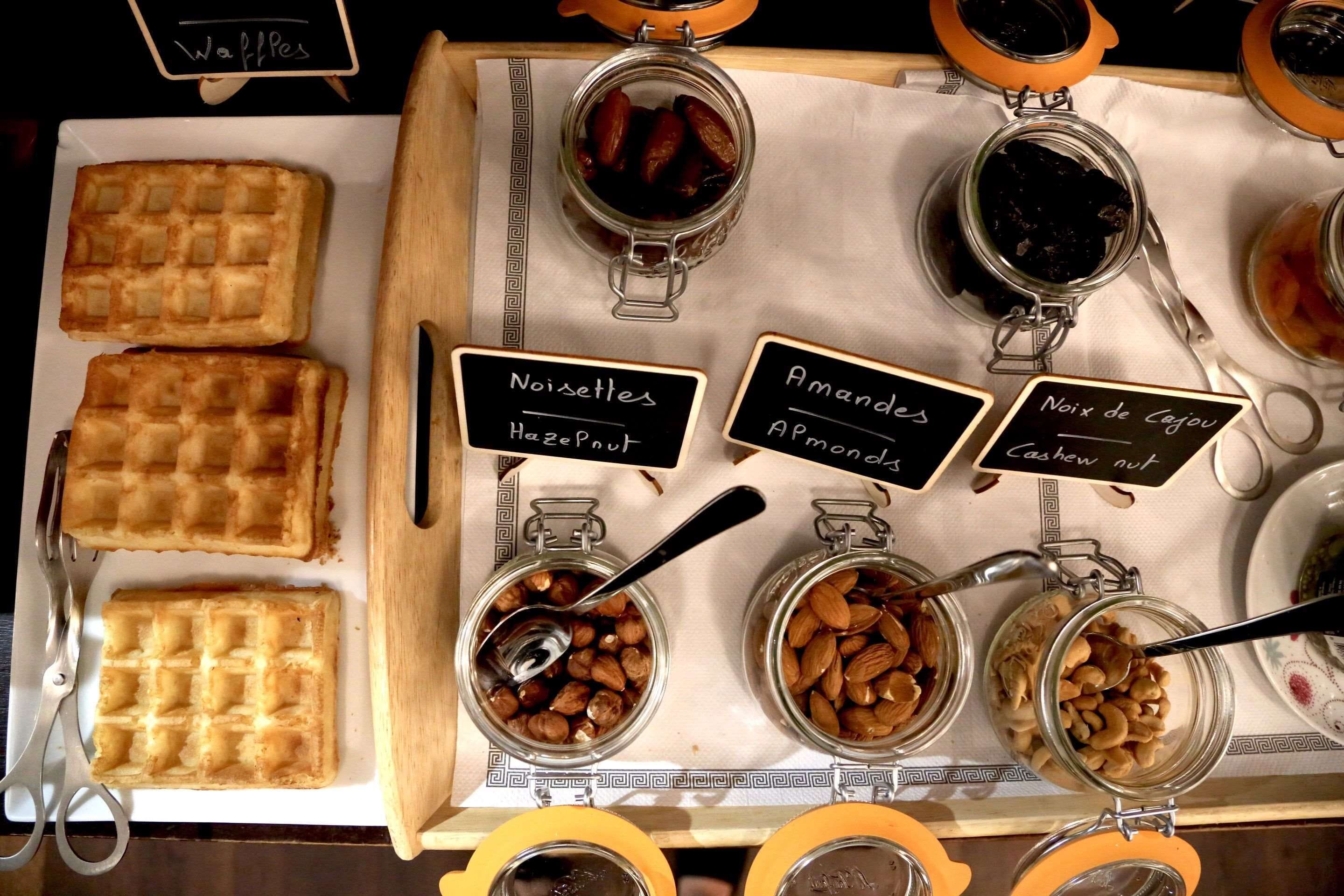 A display of waffles and various nut spreads.