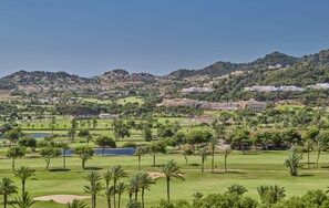 Golfers can enjoy well-maintained fairways, sand bunkers, and lush greenery on this scenic course.