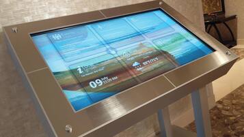 A digital display with event listings and a date/time stamp.