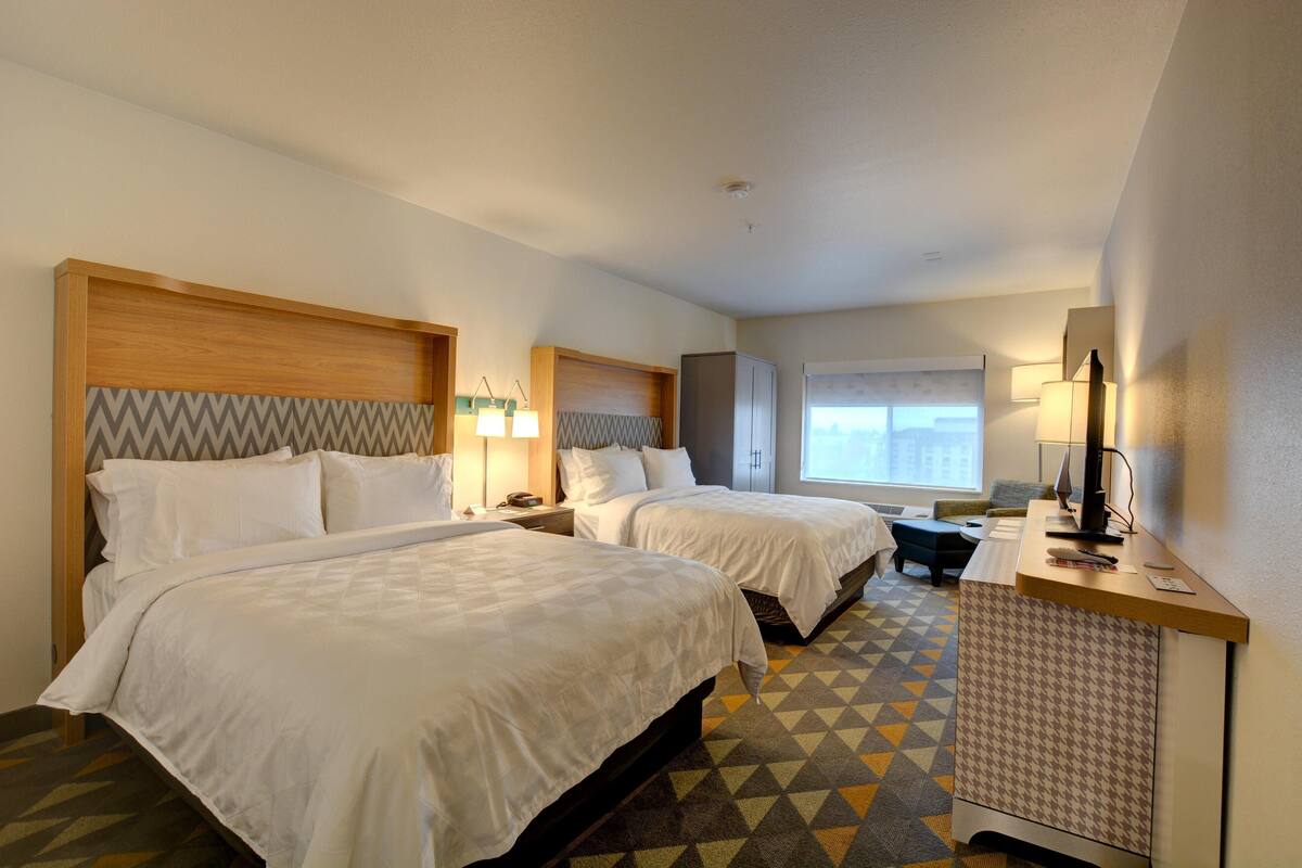 Down duvets, pillow-top beds, desk, blackout curtains