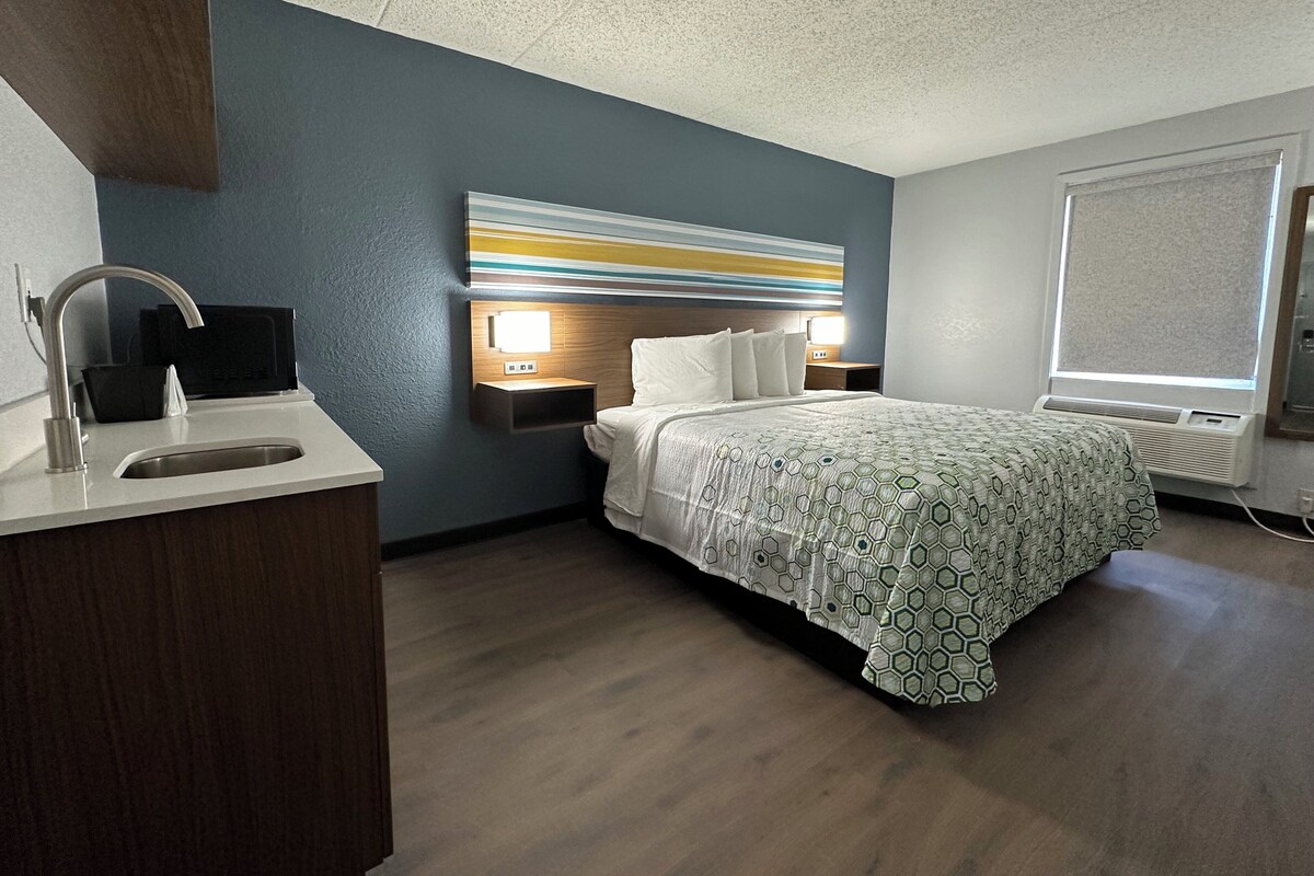 Desk, laptop workspace, blackout curtains, free WiFi