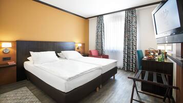 Ropa de cama de alta calidad, minibar, caja fuerte y escritorio
