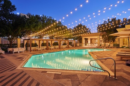 Outdoor pool, open 7:00 AM to 10:30 PM, pool loungers. DoubleTree by Hilton Dallas - Market Center