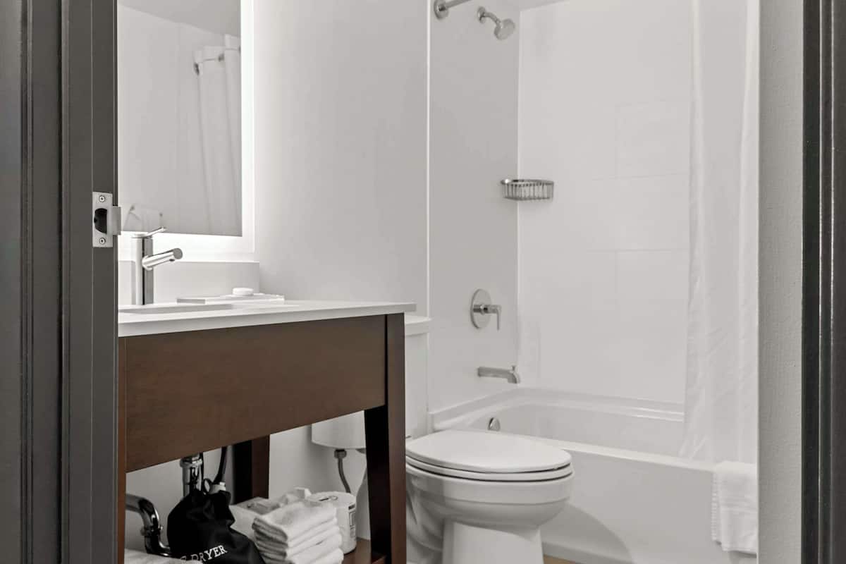 hypo-allergenic bedding, desk, blackout curtains, iron/ironing board