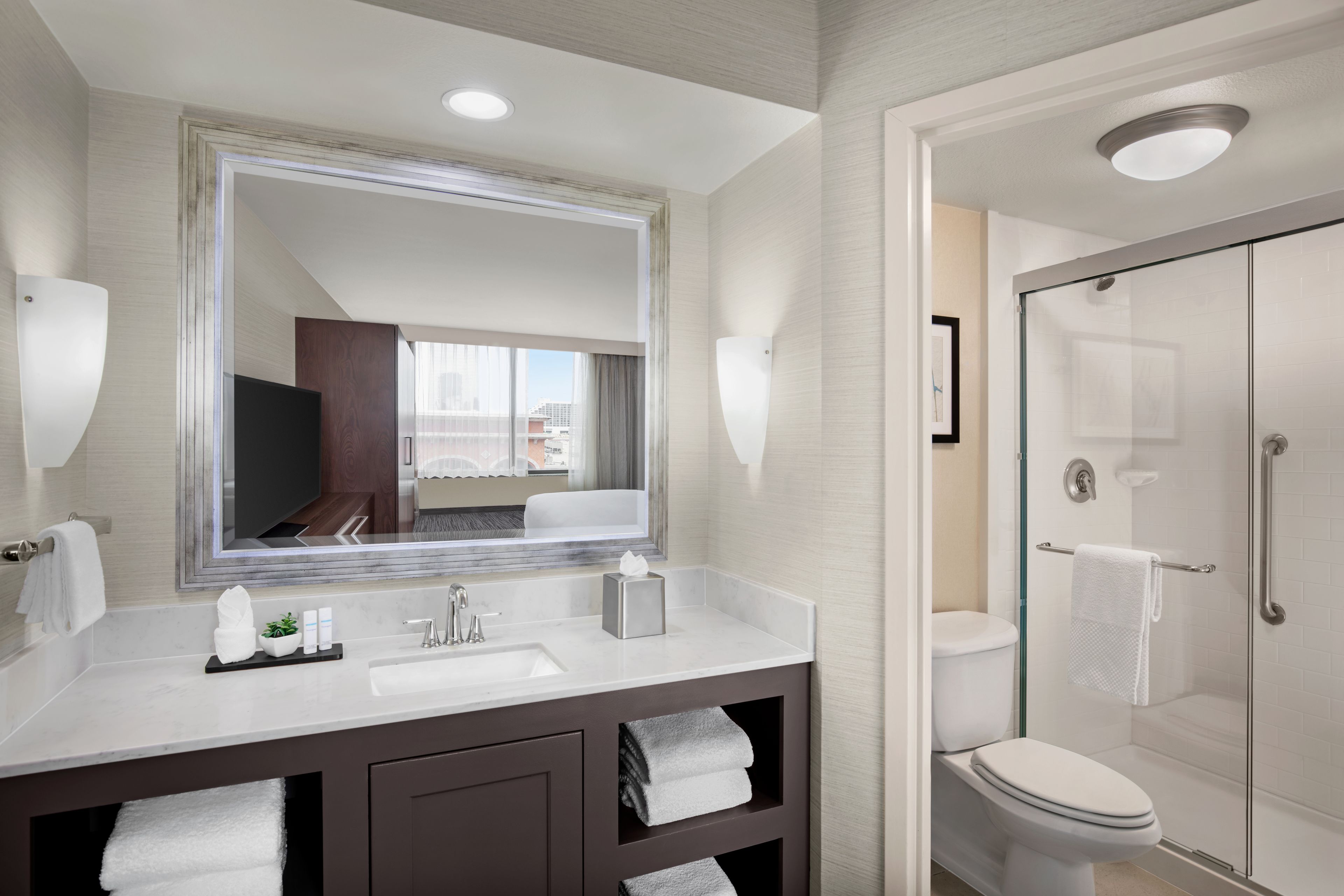 combined shower/bathtub, designer toiletries, hair dryer, towels