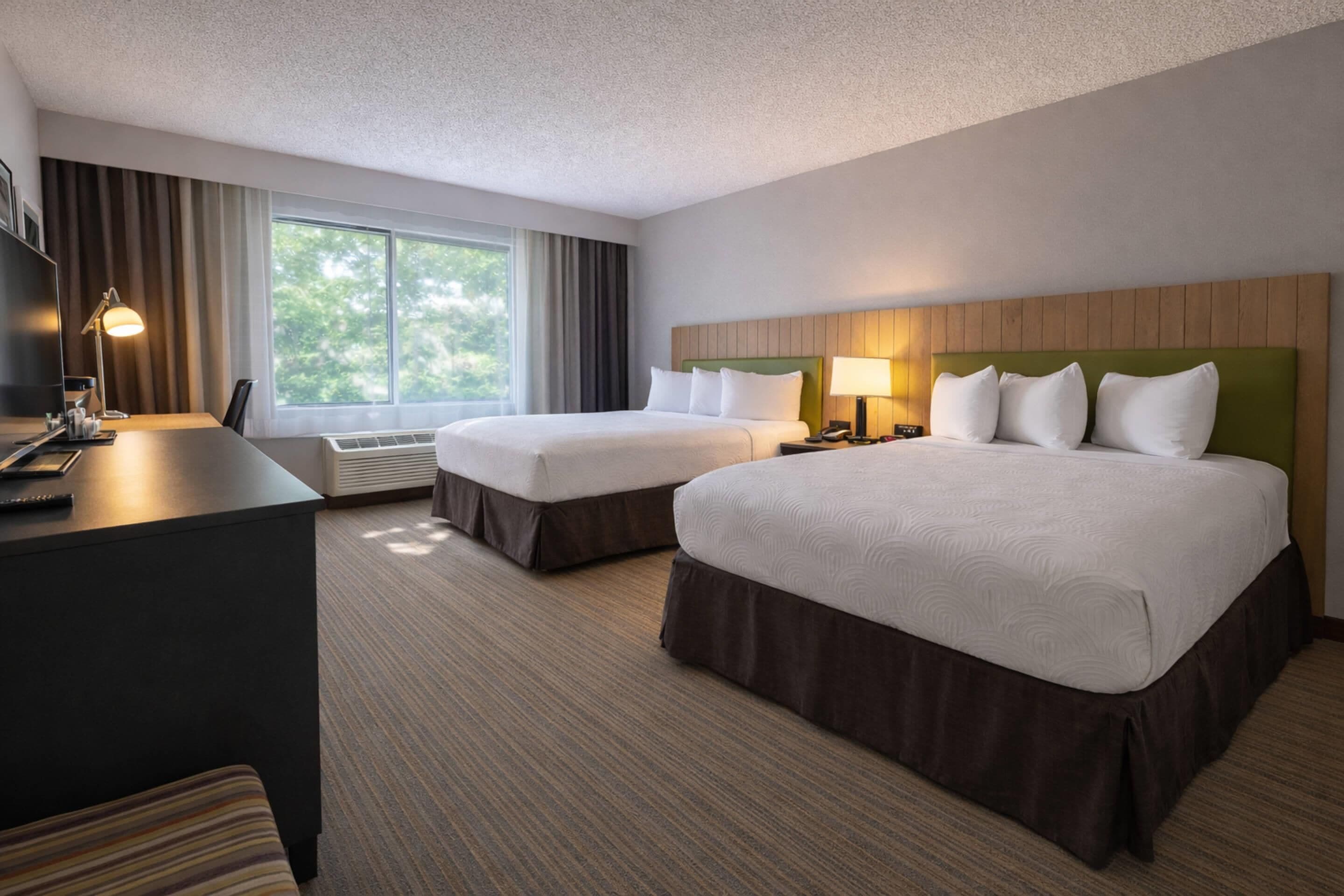 Room, 2 Queen Beds, Non Smoking | In-room safe, desk, laptop workspace, blackout drapes