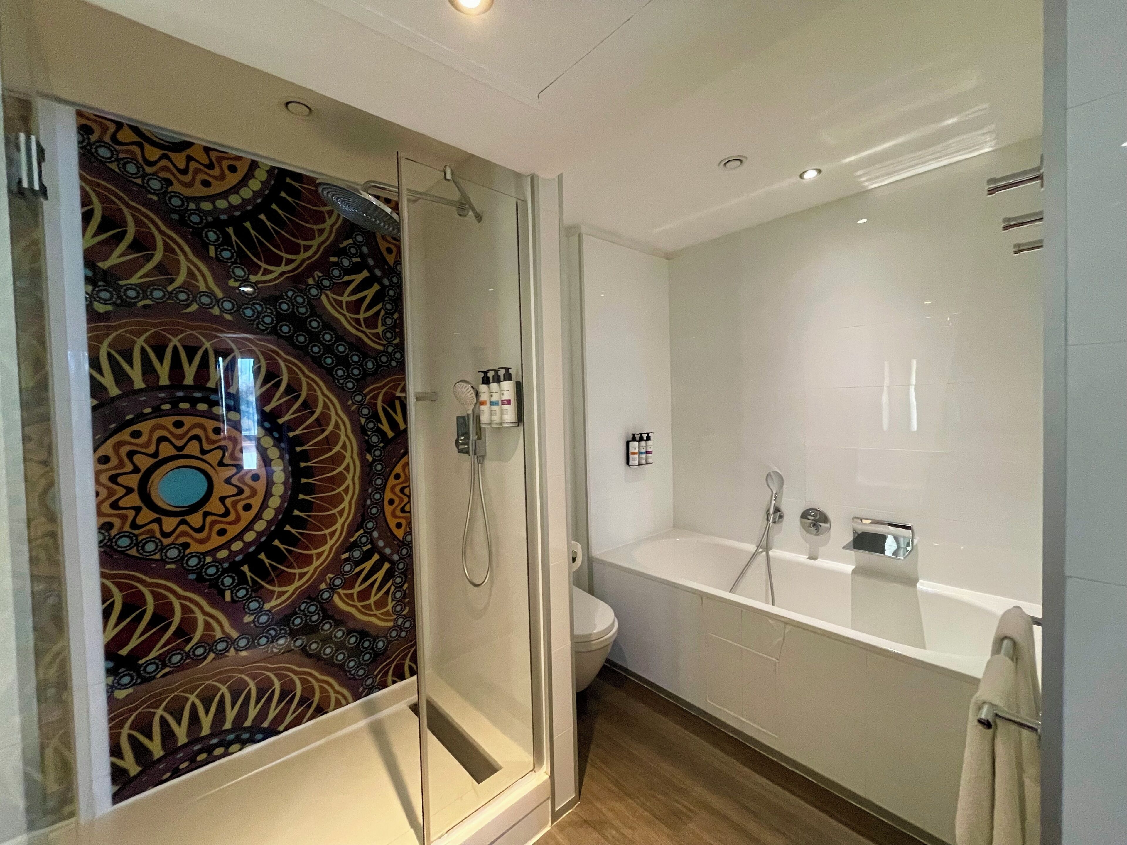 designer toiletries, hair dryer, bathrobes, towels