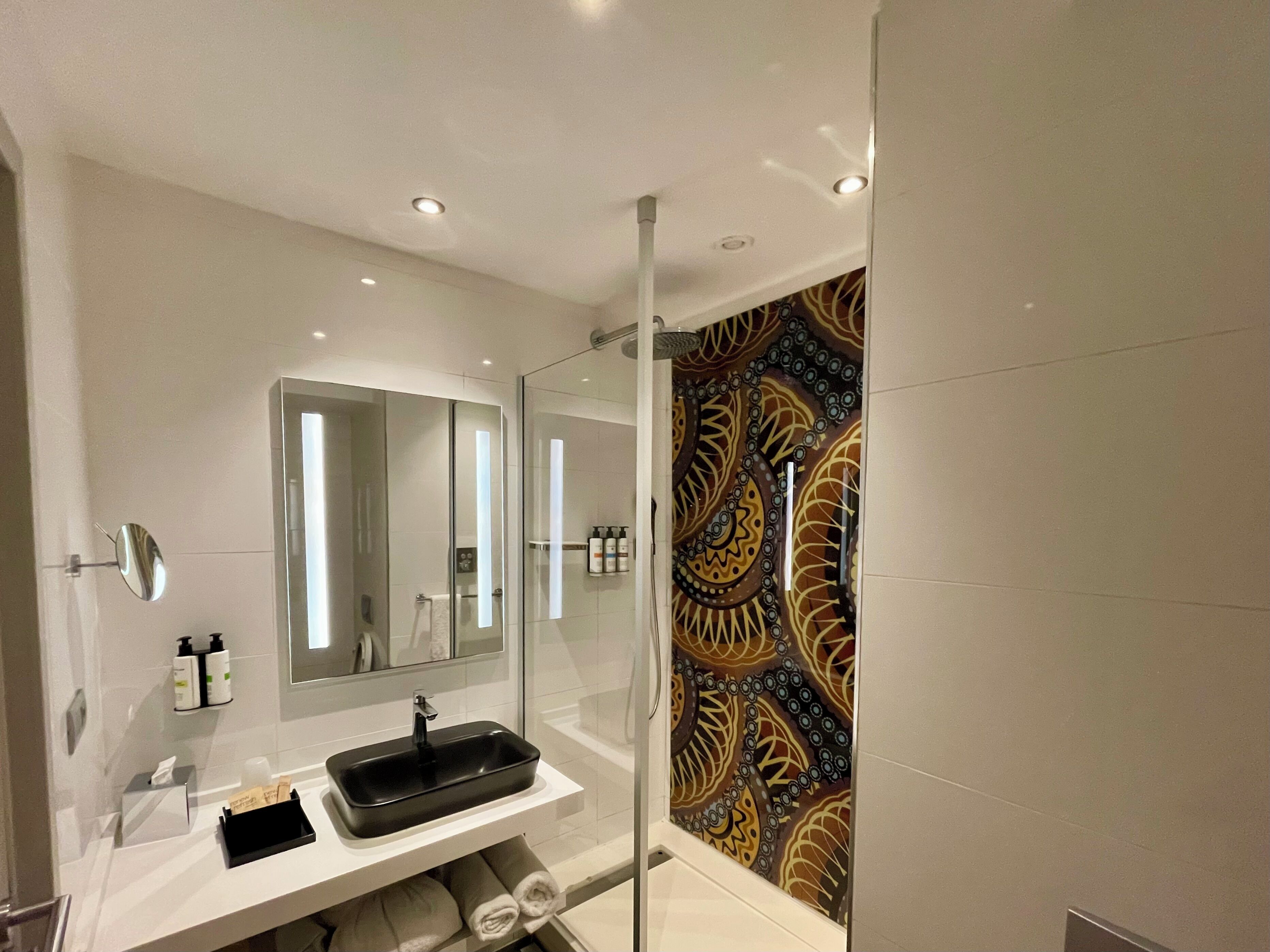 designer toiletries, hair dryer, bathrobes, towels